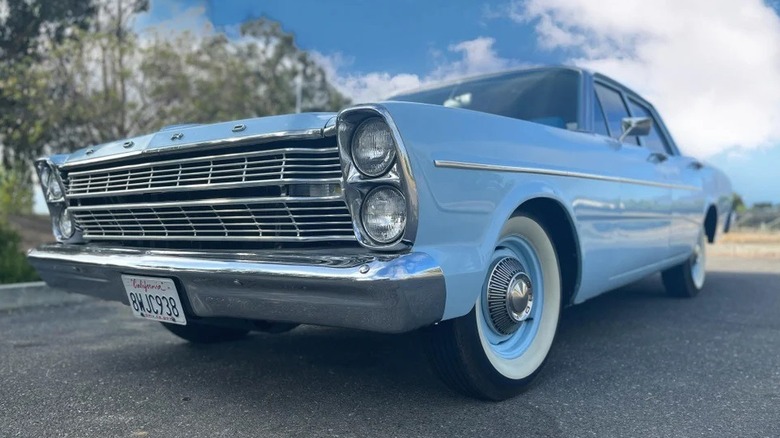A driver's side front three-quarter shot of a powder blue 1966 Ford Custom.