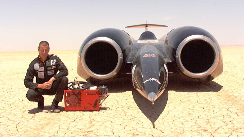 1997 Andy Green Poses With Thrustssc And The Compressor For His In-Car Breathing Air Supply On The Jafr Desert. He Is Attempting To Break The Land Speed Record.