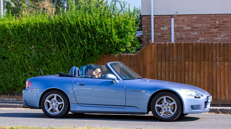 Bletchley,Bucks,UK - Aug 25th 2025: 2002 blue Honda s2000 car driving on a British road