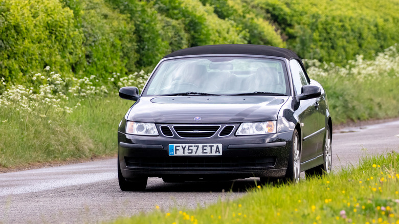 Aylesbury,Bucks,UK - May 15th 2022. Black 2007 1910cc SAAB 9-3 LINEAR ANNIV TID car travelling on an English country road