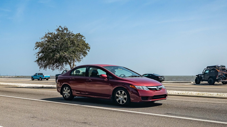 Gulfport, MS - October 04, 2023: Wide angle front corner view of a 2009 Honda Civic LX-S Sedan at a local car show.