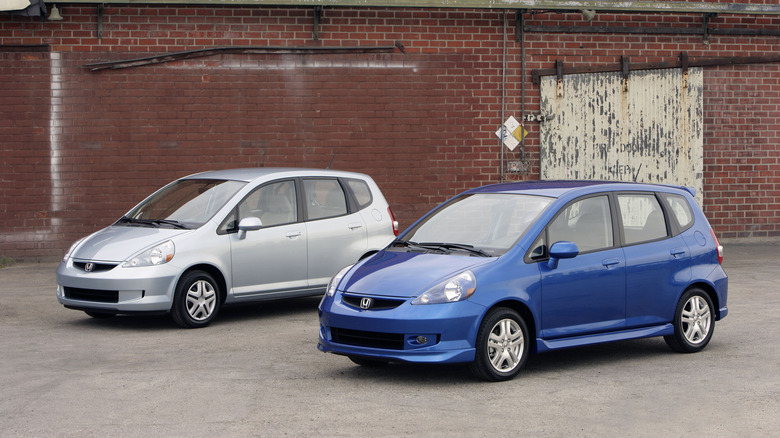 Silver Honda Fit and blue Honda Fit Sport