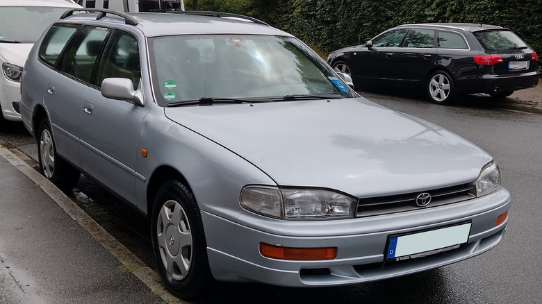 A silver Camry wagon