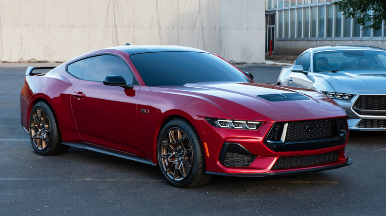 A red 2026 Ford Mustang parked next to a silver Mustang