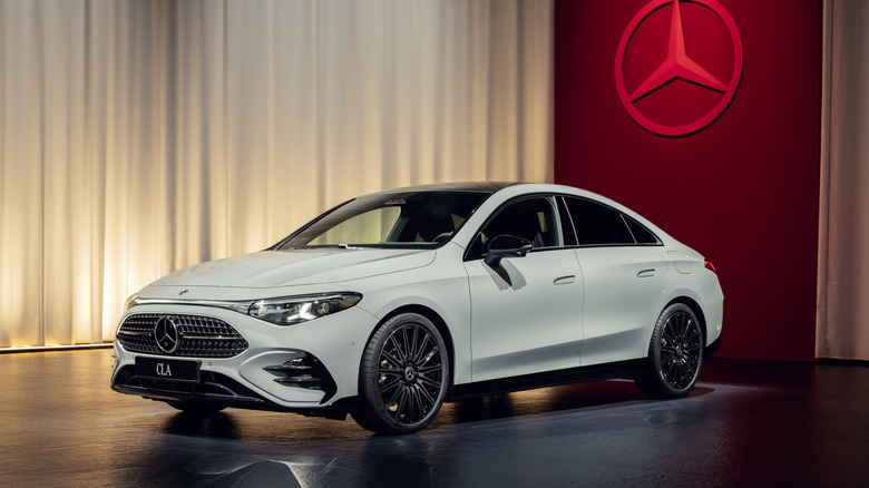 A white Mercedes-Benz CLA 350 EV on a display