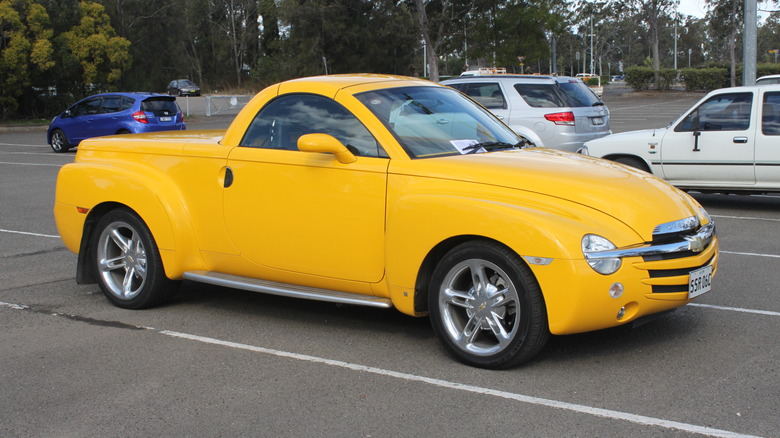 A yellow Chevrolet SSR in a parking lot