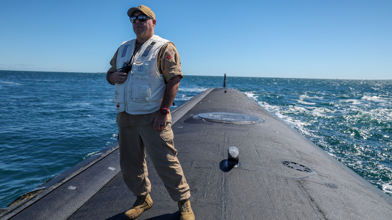 Man stands on top of the USS Minnesota