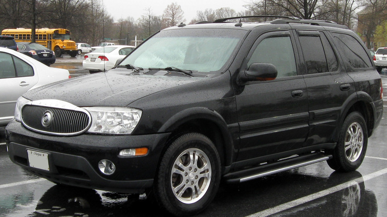 2005 Buick Rainier parked in a parking lot on a rainy day.