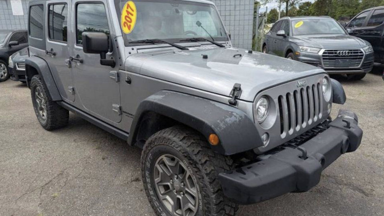 Jeep Wrangler for $15,000 in a used car lot