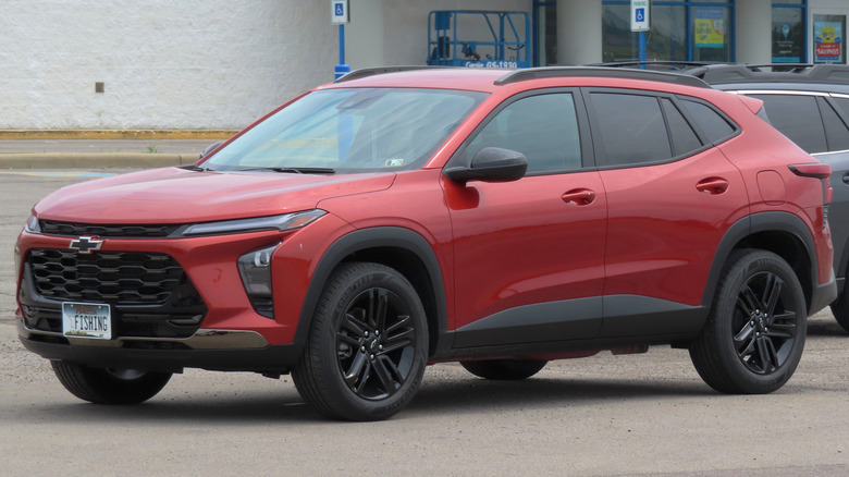 Crimson Metallic Chevrolet Trax parked on a road in front of a building