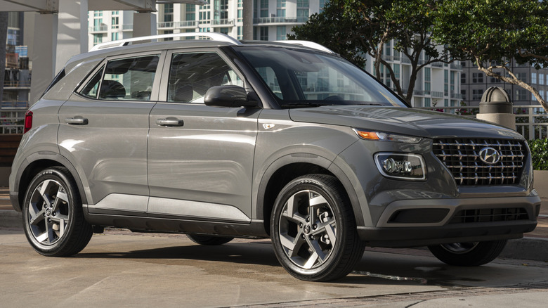 2026 Hyundai Venue parked on a paved surface with high-rise buildings in the background