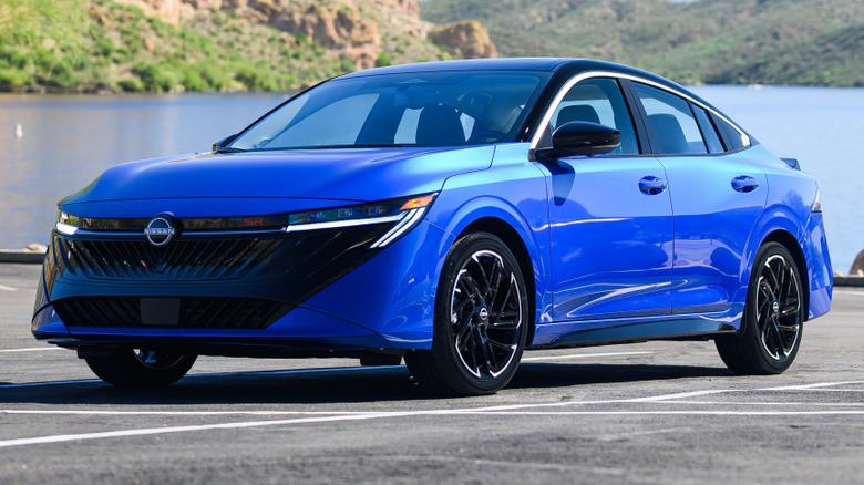 2026 Nissan Sentra SR parked on a paved surface in front of a body of water