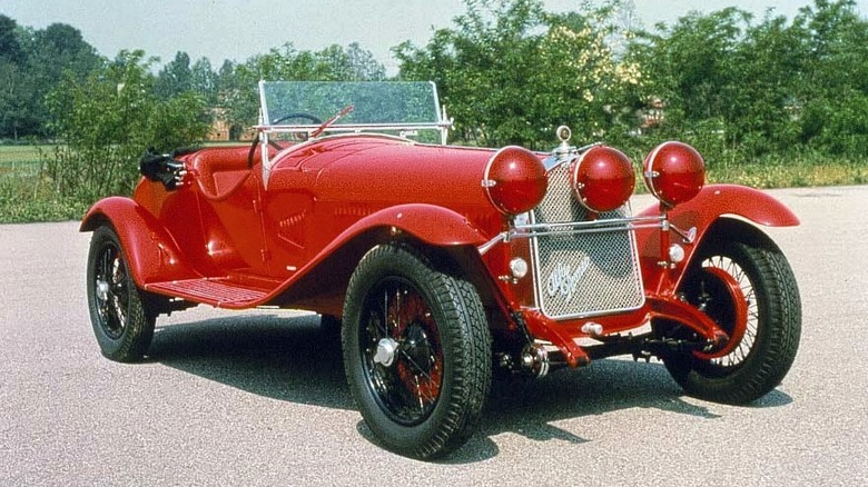 1930 Alfa Romeo 6C 1750 Gran Sport painted red, shot from the front three quarters in bright sunshine, parked up