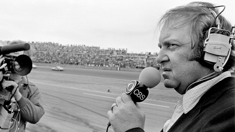 DAYTONA BEACH, FLORIDA - FEBRUARY 1981: CBS television sports broadcaster Brock Yates was among broadcasters covering the running of the 1981 Daytona 500 stock car race at Daytona International Speedway in Daytona Beach, Florida.