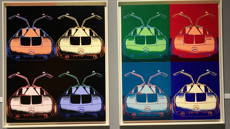A photo of Andy Warhol's Mercedes-Benz C111 silkscreen paintings hung in the Petersen Automotive Museum