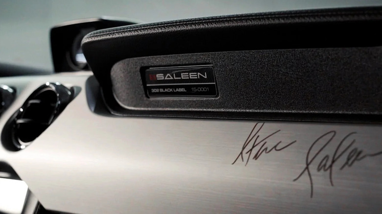 A close-up of Steve Saleen's signature on the dash of a Saleen Mustang