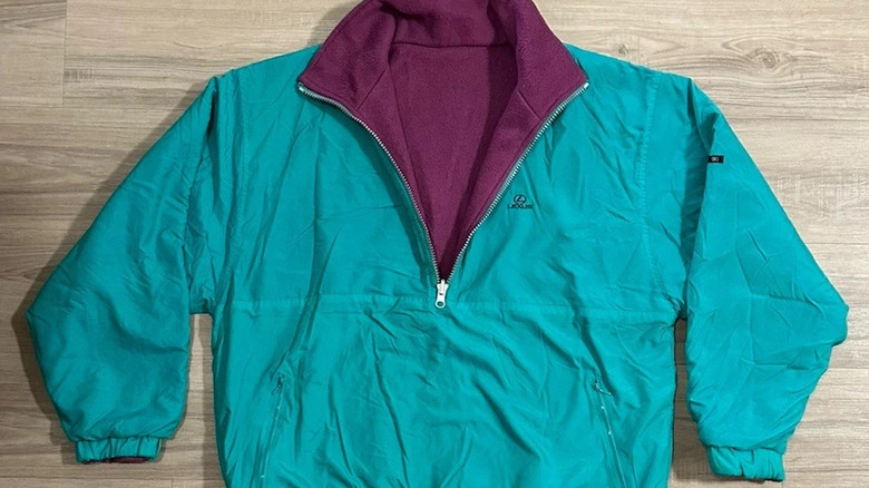 A teal and purple Lexus quarter-zip on a hardwood floor