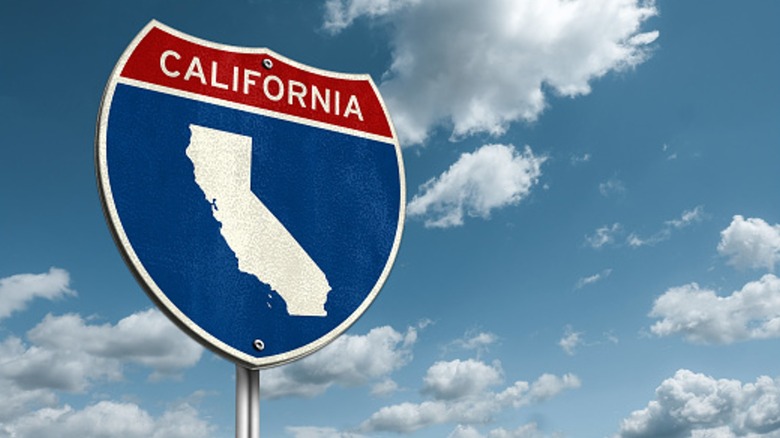 A California interstate sign with a blue sky background