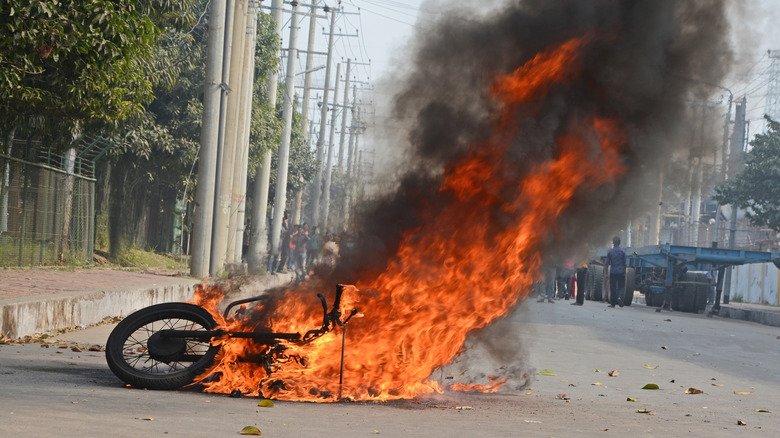 Not an actual poster's bike on fire, but an image of a bike on fire in the street.