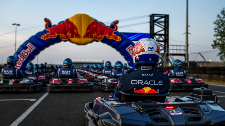 Max Verstappen sits at the back of 100 karts