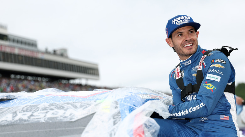 LOUDON, NEW HAMPSHIRE - AUGUST 23: Kyle Larson, driver of the #5 HendrickCars.com Chevrolet, enters his car for the NASCAR Cup Series Dollar Tree 301 at New Hampshire Motor Speedway on August 23, 2026 in Loudon, New Hampshire. (Photo by Meg Oliphant/Getty Images)