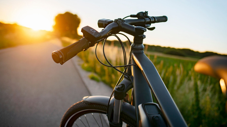 E-bike on the country road at sunset