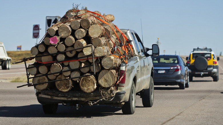 Pickup truck overloaded with cargo.