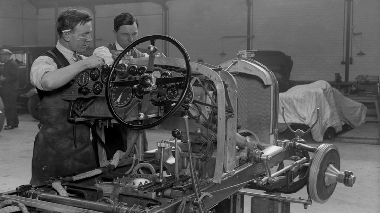 Mechanics work on a vintage Bentley