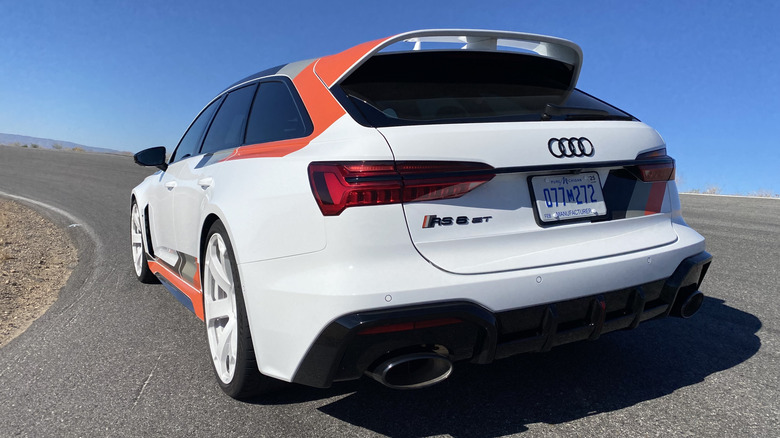 Rear three quarters shot of a white Audi RS6 Avant GT on the curve of Willow Springs