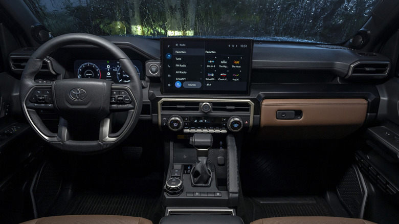 The interior of a 2025 Toyota 4Runner with large screen and infotainment on the dashboard.