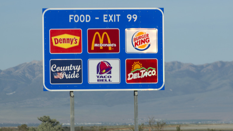 Fast food restaurants exit sign that includes Denny's, McDonald's, Burger King, Country Pride, Taco Bell and DelTaco.