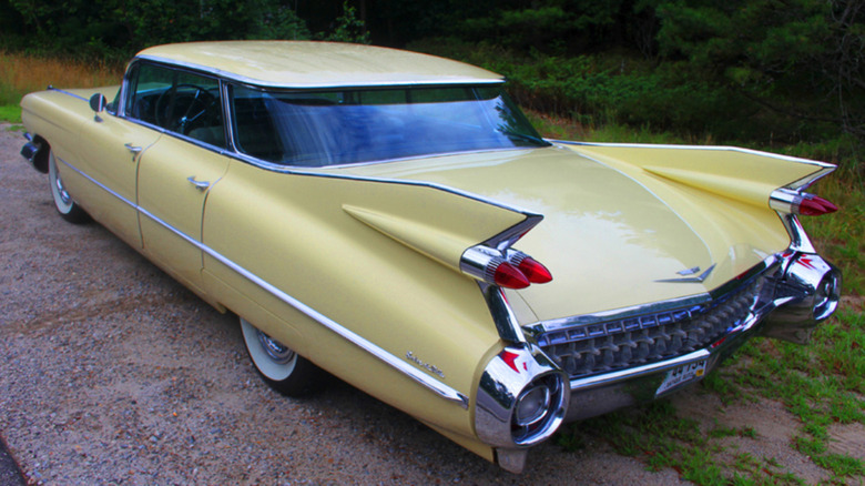 The Jet Age-inspired taillights on a light yellow 1959 Cadillac Sedan Deville.