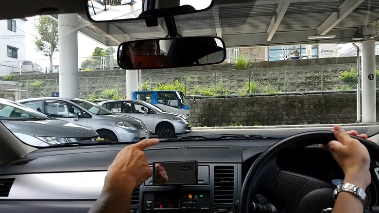 Japanese student driver practicing the test with instructor