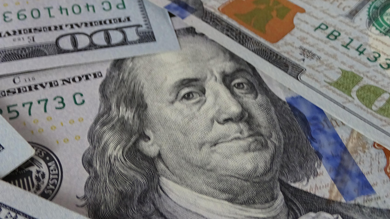 a pile of $100 bills