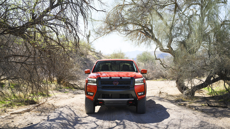 2025 Nissan Frontier Pro-4X parked between desert trees
