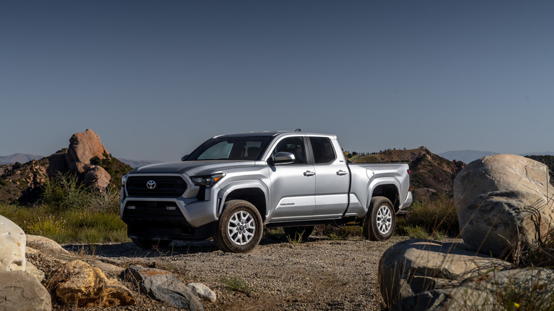 2025 Toyota Tacoma parked off-road near rocks