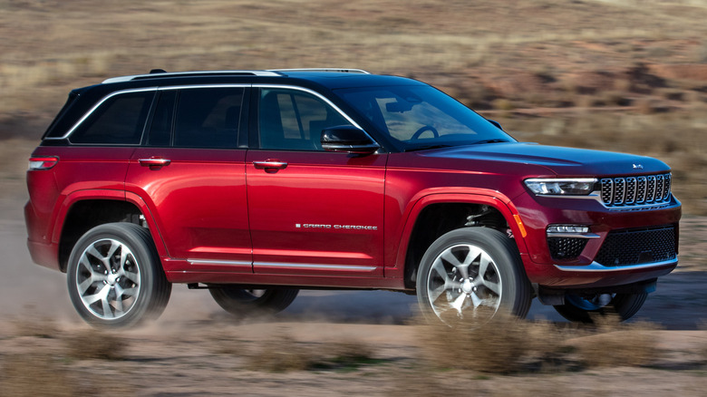 2025 Jeep Grand Cherokee driving on a dirt road