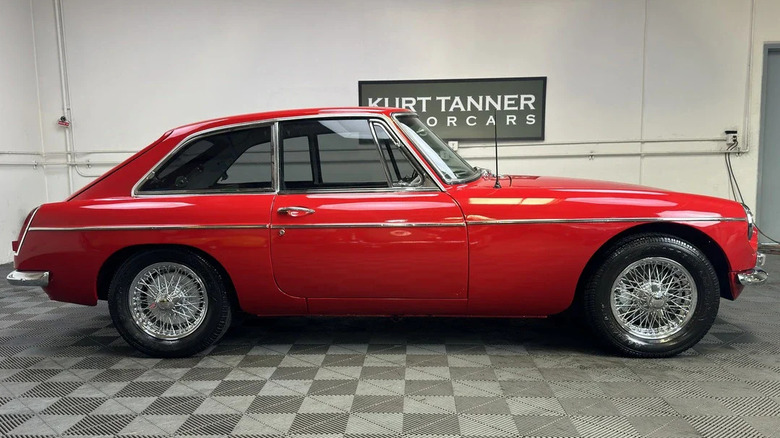 The cutest little red 1966 MG MGB with the triangle windows.