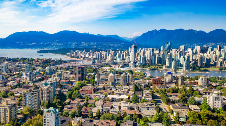 An aerial position of Vancouver pinch majestic mountains successful nan background. BC, Canada