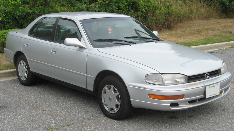 a  silver 1997 Toyota Camry parked in a parking lot