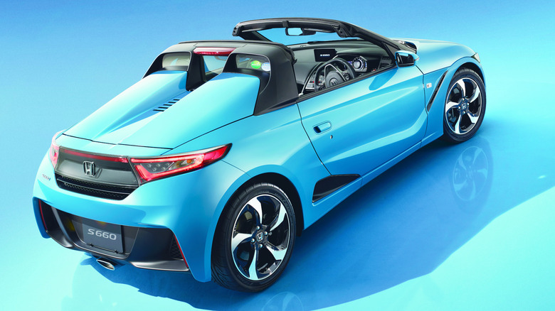 A blue Honda S660 convertible