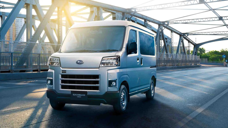A silver Subaru Sambar van