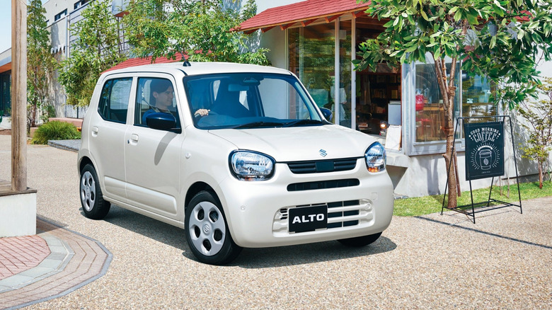 A silver Suzuki Alto