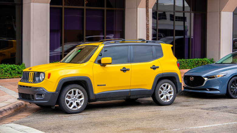 Coral Gables, FL, USA - May 12, 2025: Yellow Jeep Renegade SUV