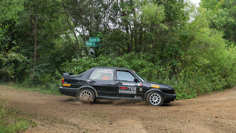 PARK RAPIDS, MINNESOTA - AUGUST 23: Driver Andrew Cowan and co-driver John Vinti of the #769 1990 Volkswagen Jetta VR6 compete on stage 12 of the ARA Ojibwe Forests Rally on August 23, 2025 in Park Rapids, Minnesota. (Photo by Steven Garcia/Getty Images)