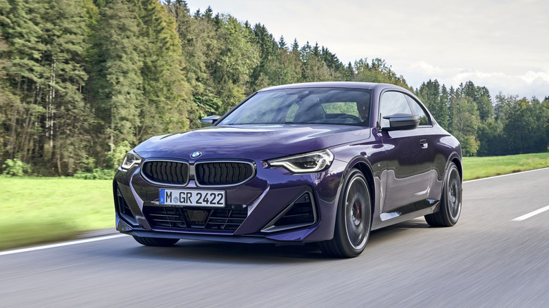 Front 3/4 view of a purple BMW 2 Series coupe