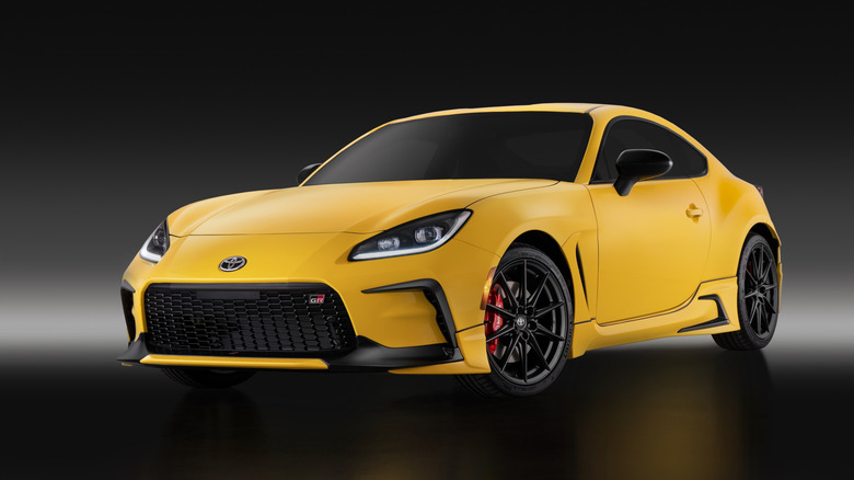 Front 3/4 view of a yellow Toyota GR86