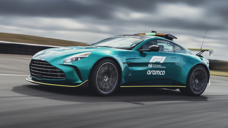 Front 3/4 view of a green Aston Martin Vantage safety car
