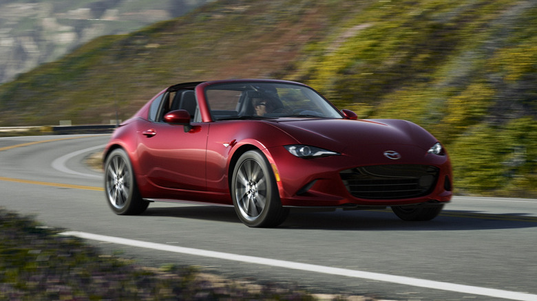 Front 3/4 view of a red Mazda Miata RF