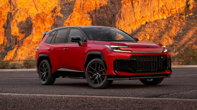 Front 3/4 view of a red Toyota RAV4 GR Sport